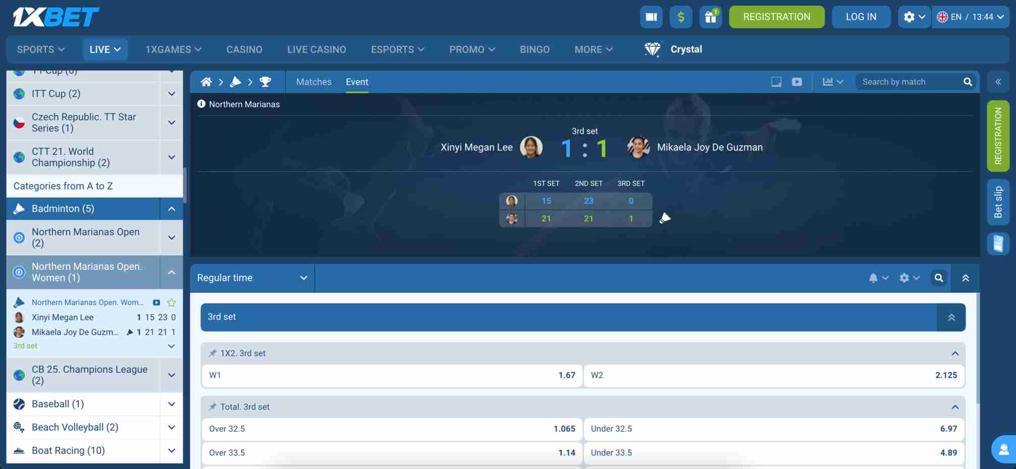 Live 1xBet badminton match between Xinyi Megan Lee and Mikaela Joy De Guzman displaying betting odds during the third set.